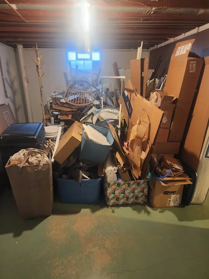 Roll-off dumpster container at job site for 2 Yard Dumpster Rental in Red Hook